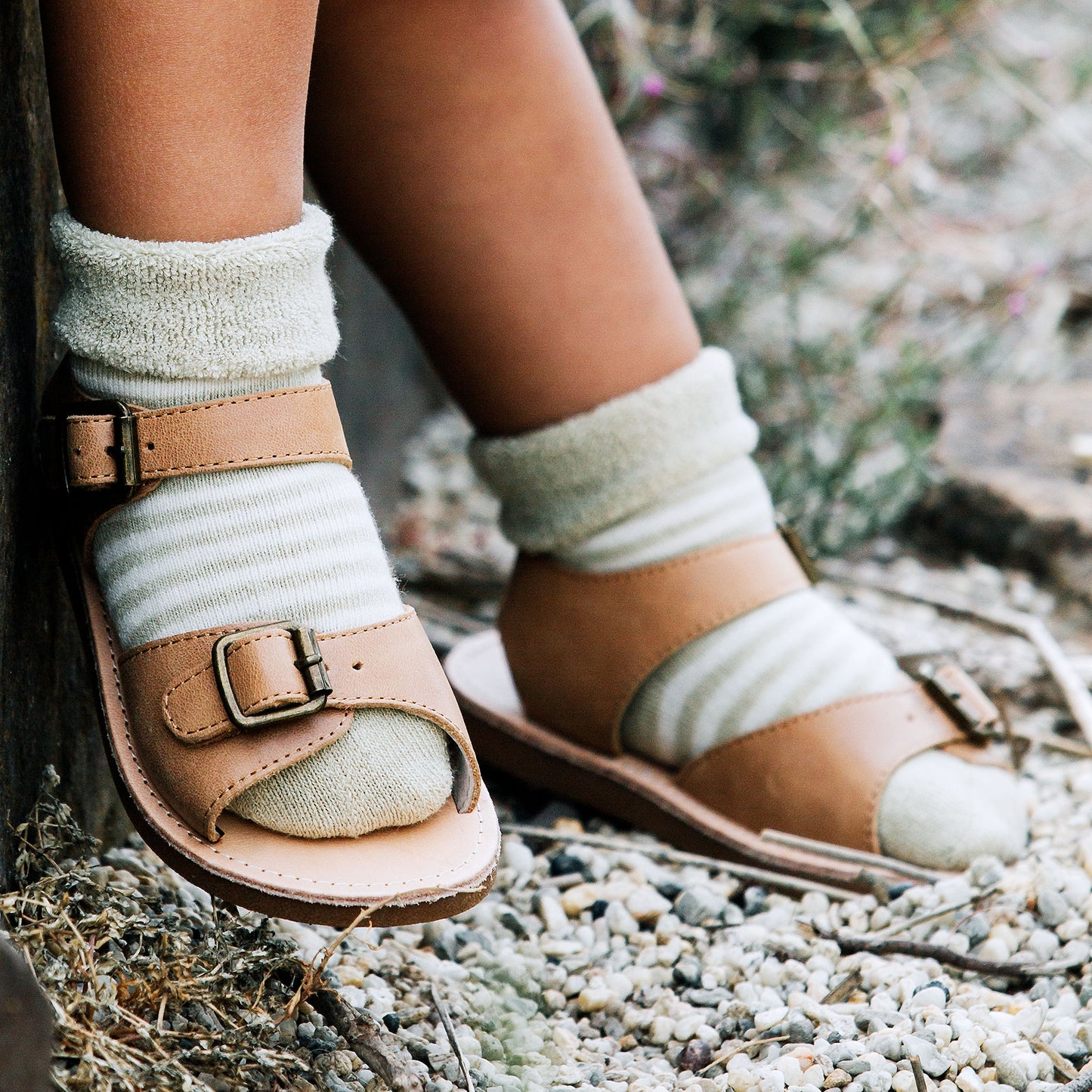 Baby in Sage stripe socks,Rolled back cuff