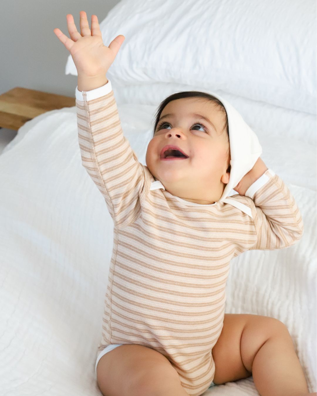 Happy baby in striped long sleeve bodysuit & Beanie