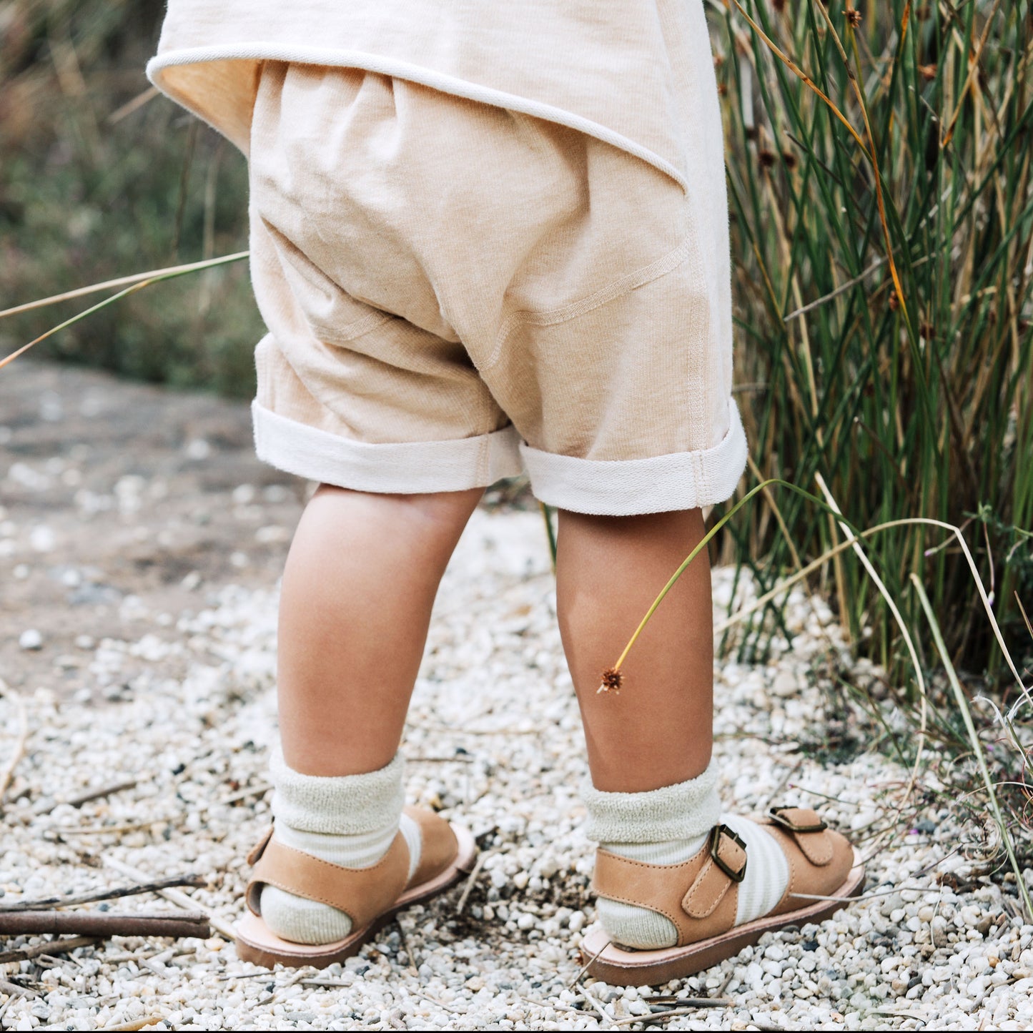 Baby in Rompeezi & socks