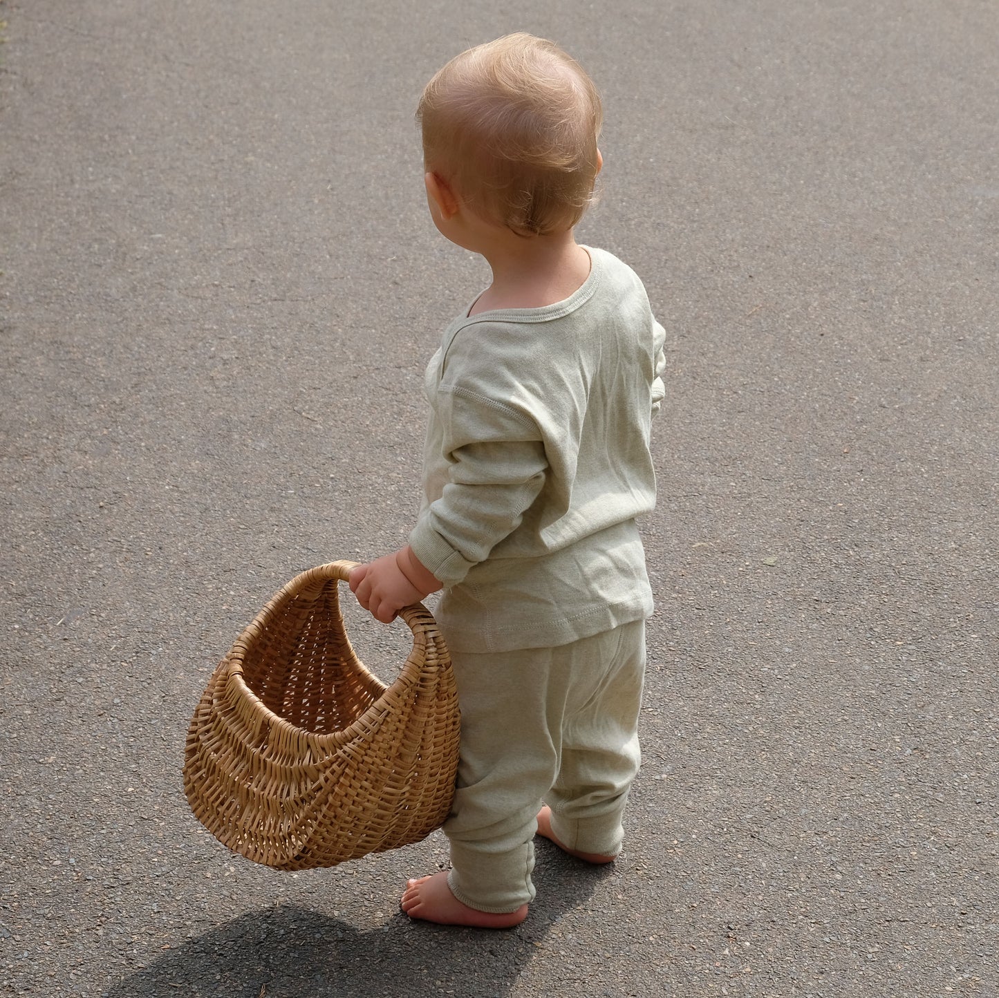 Baby in sage pants