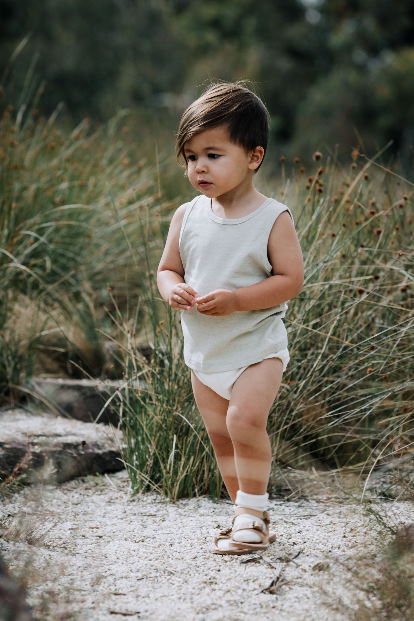 Baby in Sage singlet, play in the garden