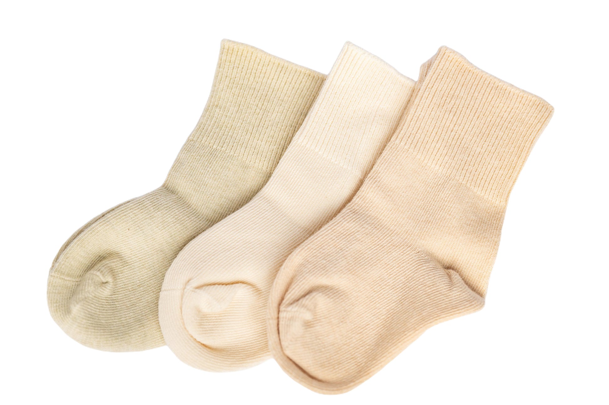 Three plain socks in beige, brown, and white colors, made of organic cotton, displayed together.
