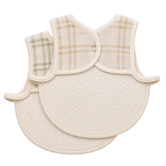 Two baby bibs with plaid and textured designs on a white background