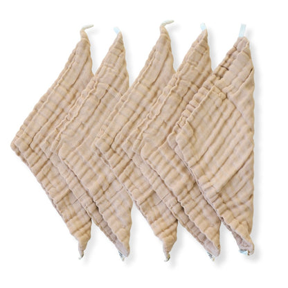 A set of beige organic cotton reusable baby wipes in brown undyed 